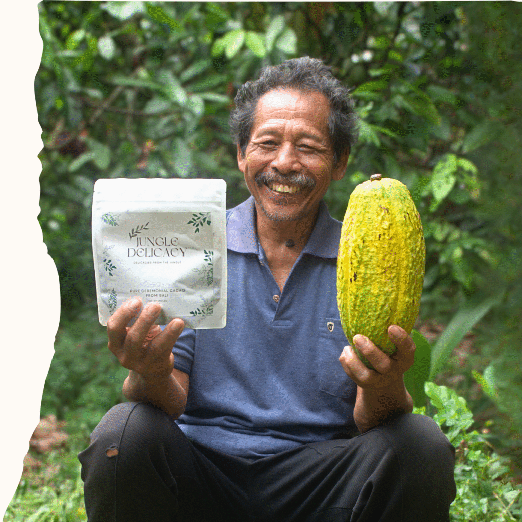Balinese cacao farmer holding cacao pod and jungle delicacy 250g ceremonial cacao